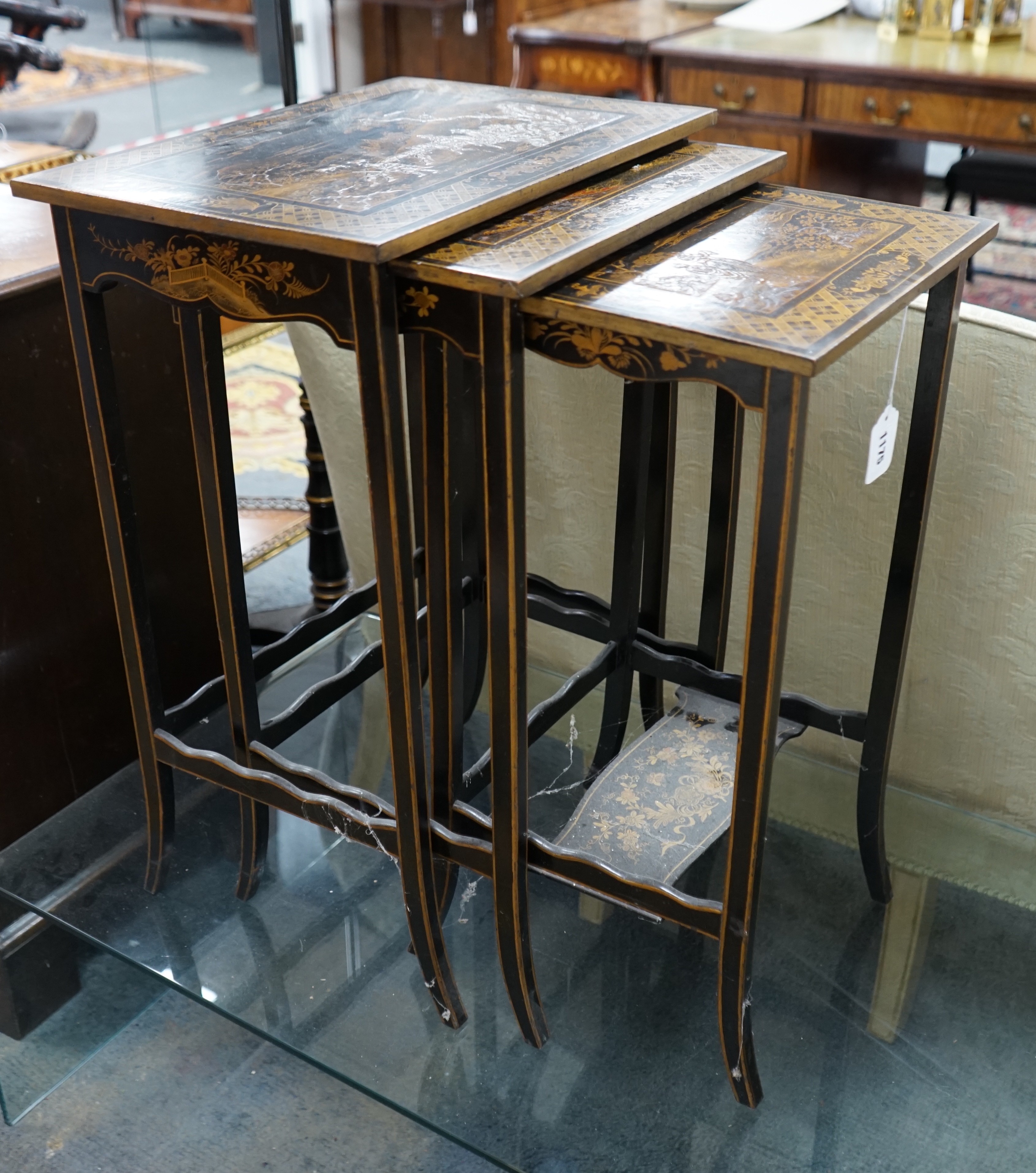 A graduating nest of three rectangular chinoiserie lacquer tea tables, width 46cm, depth 33cm, height 67cm